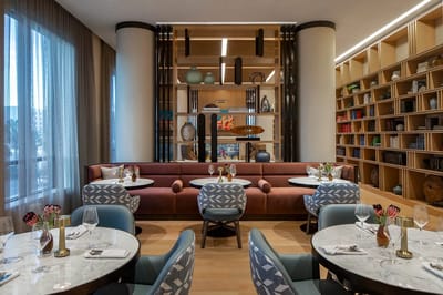 Stylish dining room with modern decor and tables