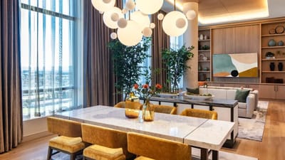 Bright and modern common area with dining table and seating