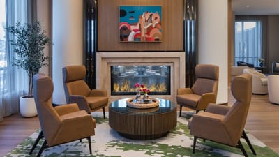 Modern lounge area with seating and fireplace