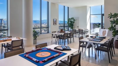 Bright game room with tables and scenic views