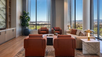 Bright common area with modern furniture and large windows