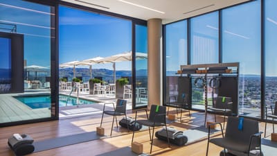 Interior view of a fitness area with large windows