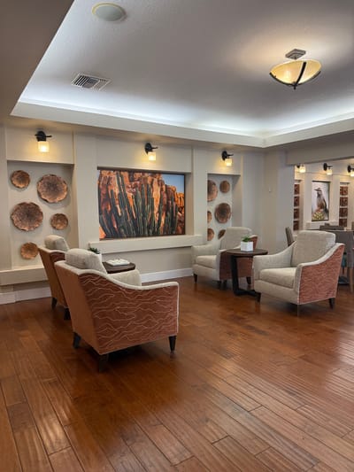 Comfortable common area with stylish seating and art