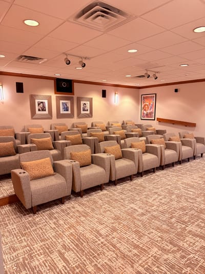 Cozy theater-style lounge with armchairs