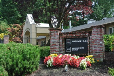 Exterior view of Autumn Hills facility with flowers