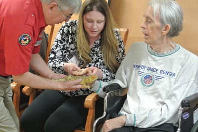 Residents participating in a pet therapy session