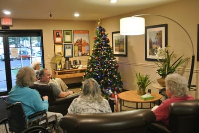 Residents enjoying a festive gathering in the lounge area