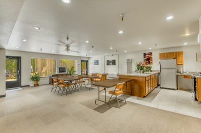 Interior view of a common area with tables and chairs