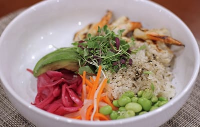 A colorful bowl of food with various ingredients