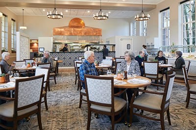 Residents dining in a spacious dining room