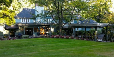 Exterior view of Hopewell House surrounded by greenery