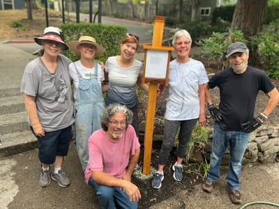 Residents and staff gathered in a garden area