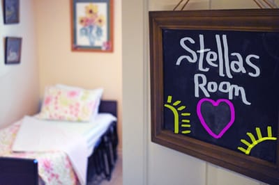 Sign for a resident's room with floral decor
