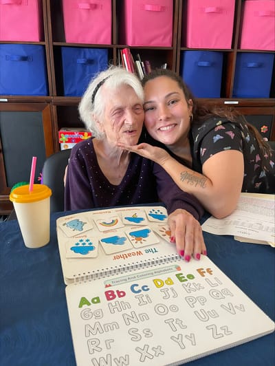 Resident and staff member engaged in an activity