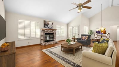 Bright common area with seating and fireplace