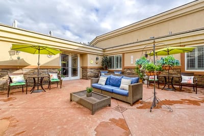 Outdoor patio area with seating and umbrellas