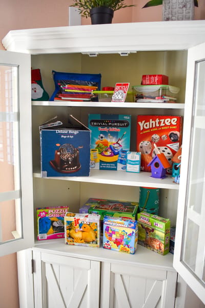 A cabinet filled with games and activities for seniors