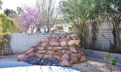 Rock feature in a landscaped outdoor area