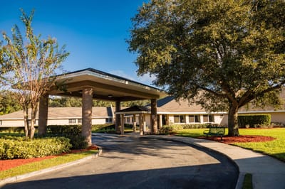 Entrance of the Lake Bennet Center surrounded by trees