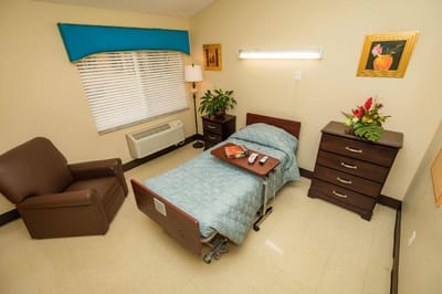 Cozy resident room with bed and furnishings
