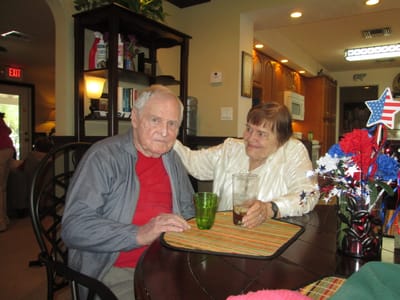Two residents enjoying each other's company in the common area