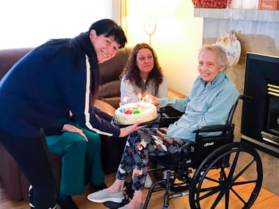 Celebrating a resident's birthday with a cake