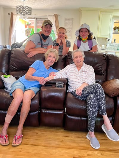 Residents and family members enjoying time together in the lounge