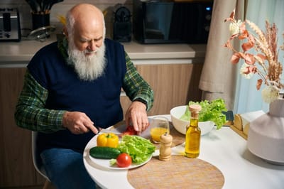 Resident preparing food in a bright kitchen
