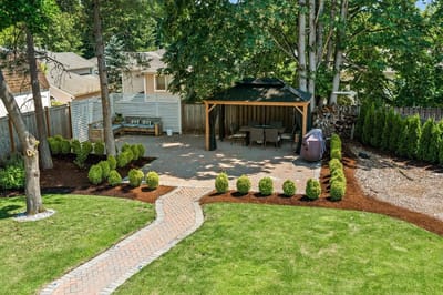 Well-maintained outdoor space with a patio and garden.