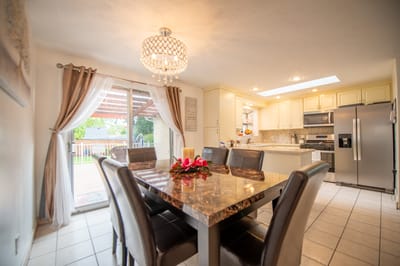 Bright kitchen area with a dining table and outdoor view