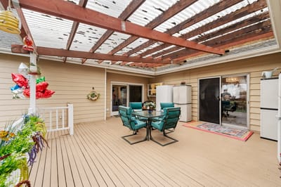 Covered outdoor patio area with seating