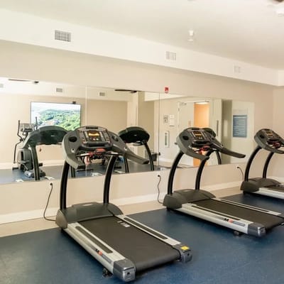Interior view of a fitness room with treadmills