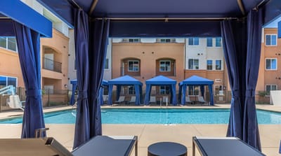 View of a pool area with cabanas