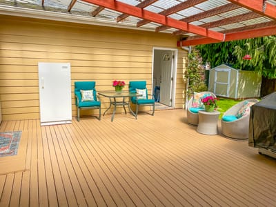Outdoor patio area with seating and flowers
