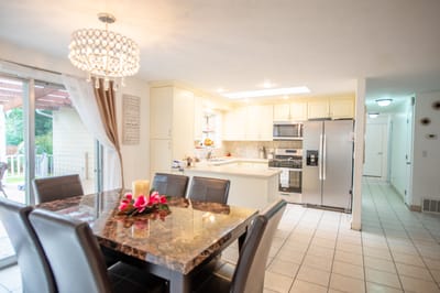Bright kitchen area with a dining table and modern appliances