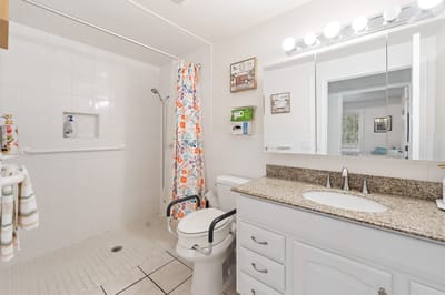 A clean, accessible bathroom with bright decor
