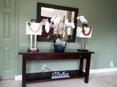 Decorative table with flowers and 'Aloha' sign
