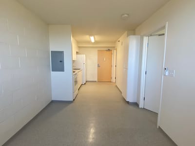 Interior hallway with kitchenette area visible