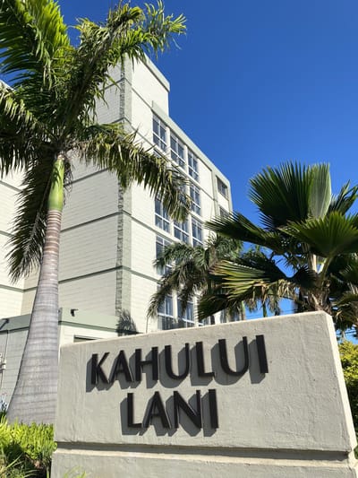 Exterior view of Kahului Lani building with palm trees
