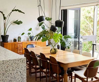 A bright dining area with a large wooden table
