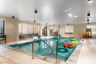 Indoor pool area with colorful floats
