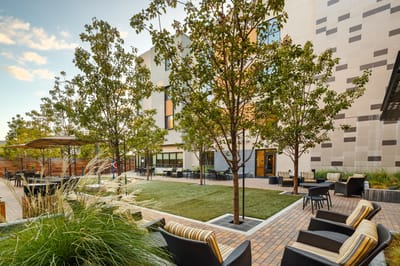 Outdoor patio area with seating and trees
