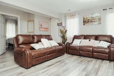 Cozy common area with leather sofas and decorative art