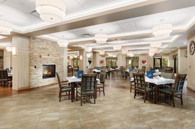 Bright dining room area with tables and chairs