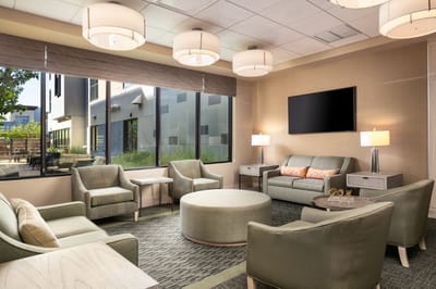 Comfortable common area with seating and a TV