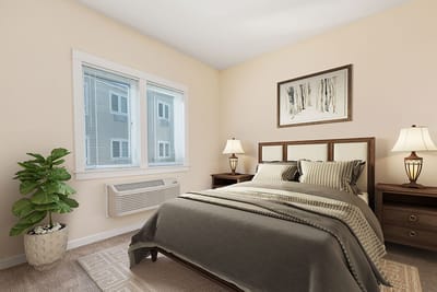 Well-decorated private resident room with a bed and decor