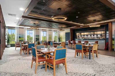 Dining room with tables and chairs set up for meals