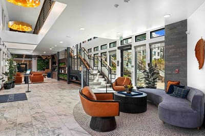 Bright interior common area with seating and plants