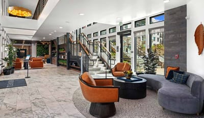 Modern lobby area with comfortable seating and greenery