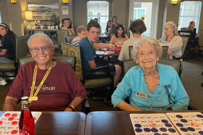 Residents playing bingo in a common area